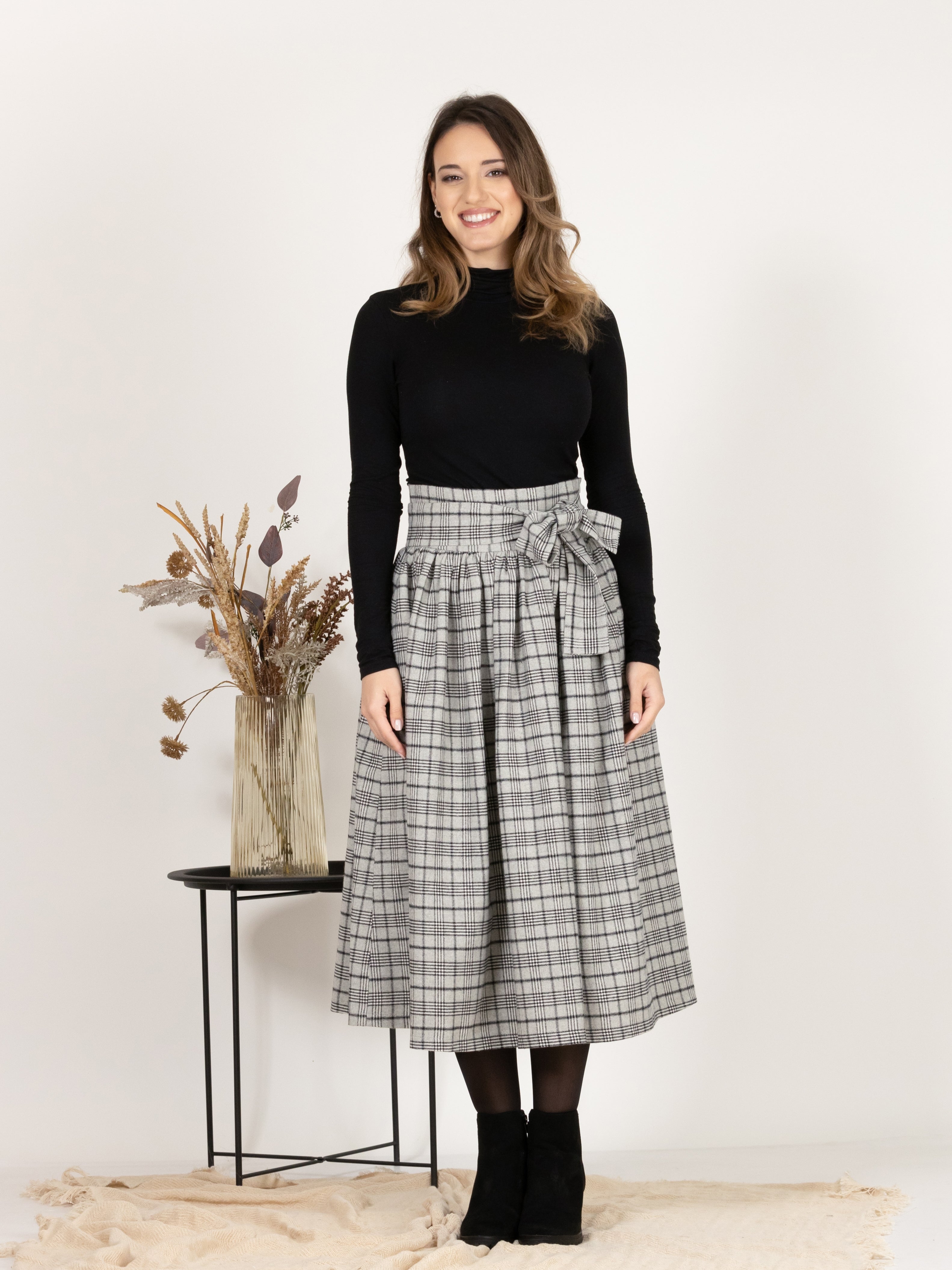Front view of Wool Midi Plaid Skirt with High Waisted Bow and Pockets
showcasing classic design