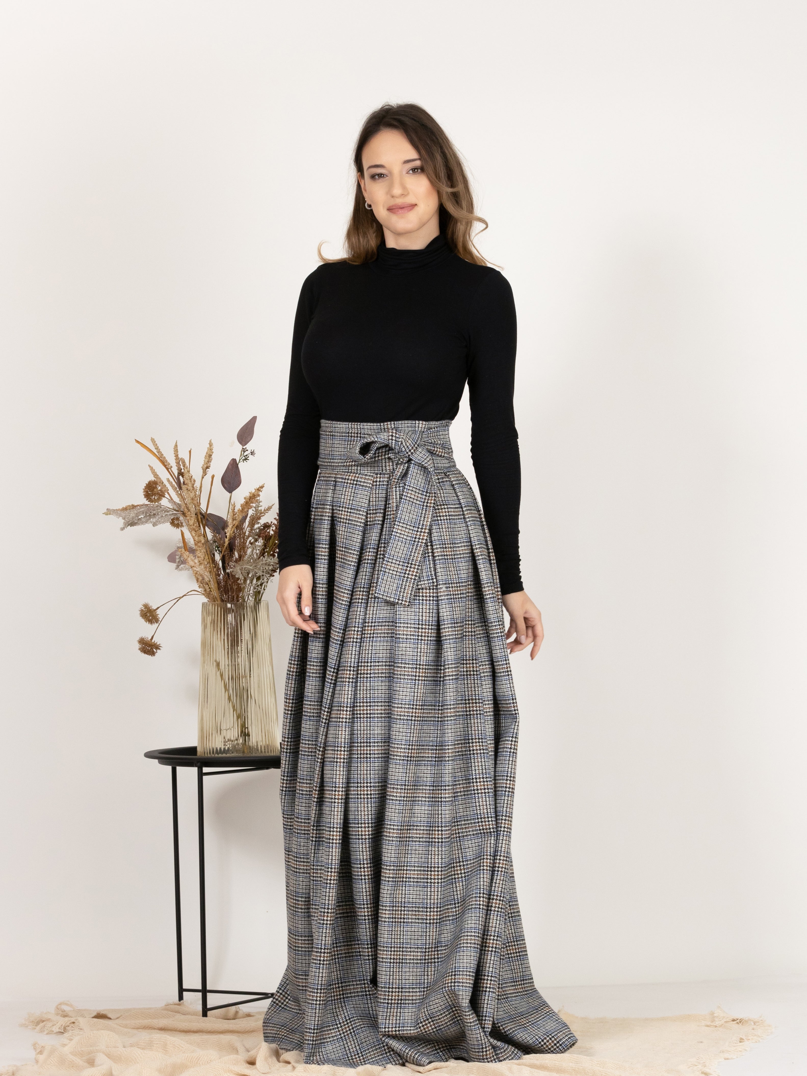 Front view emphasizing the high waist of Plaid Wool Pleated Skirt with Ultra High Waist and Bow