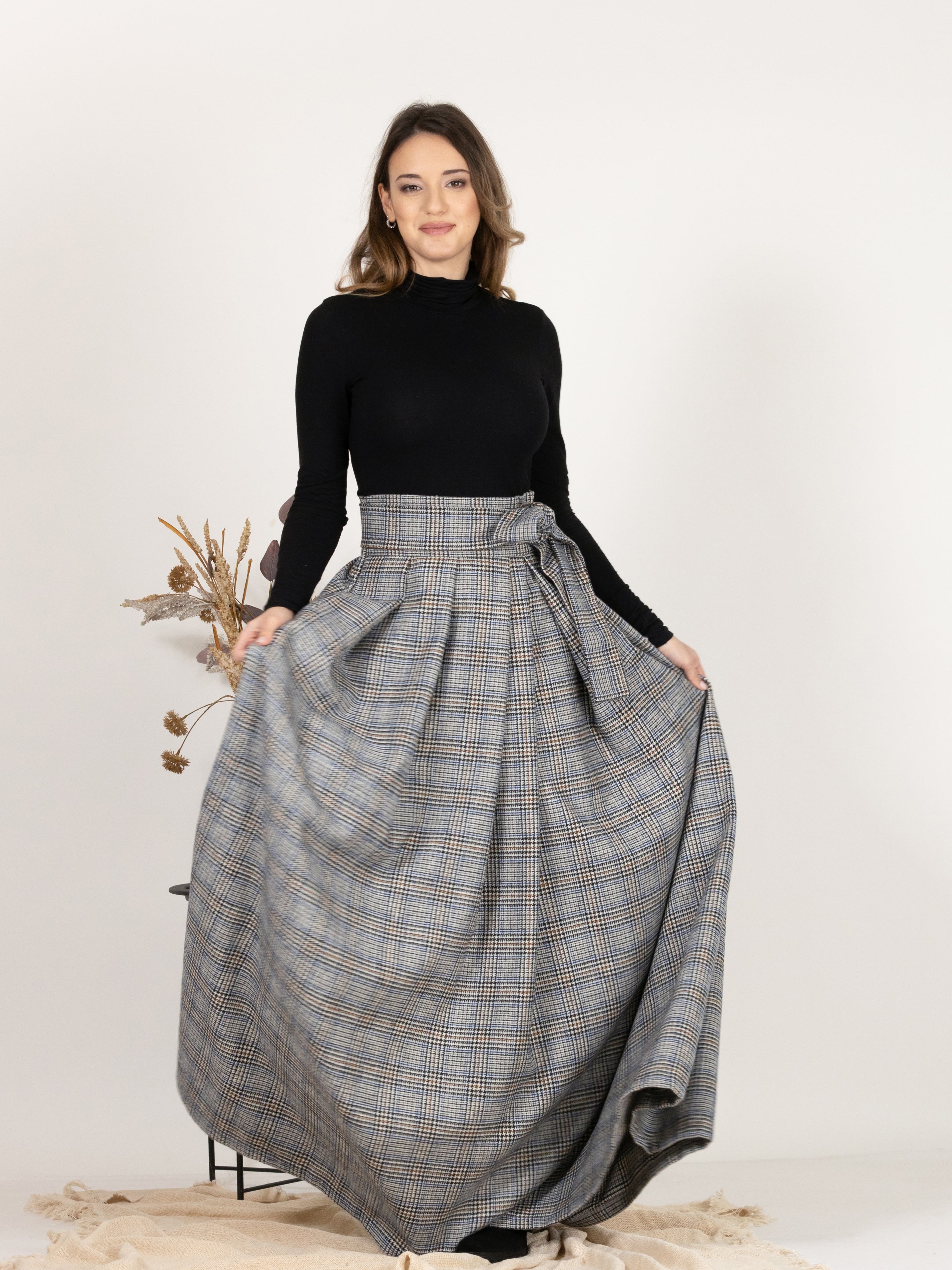 Front view showcasing A-line, flared silhouette of Plaid Wool Pleated Skirt with Ultra High Waist and Bow