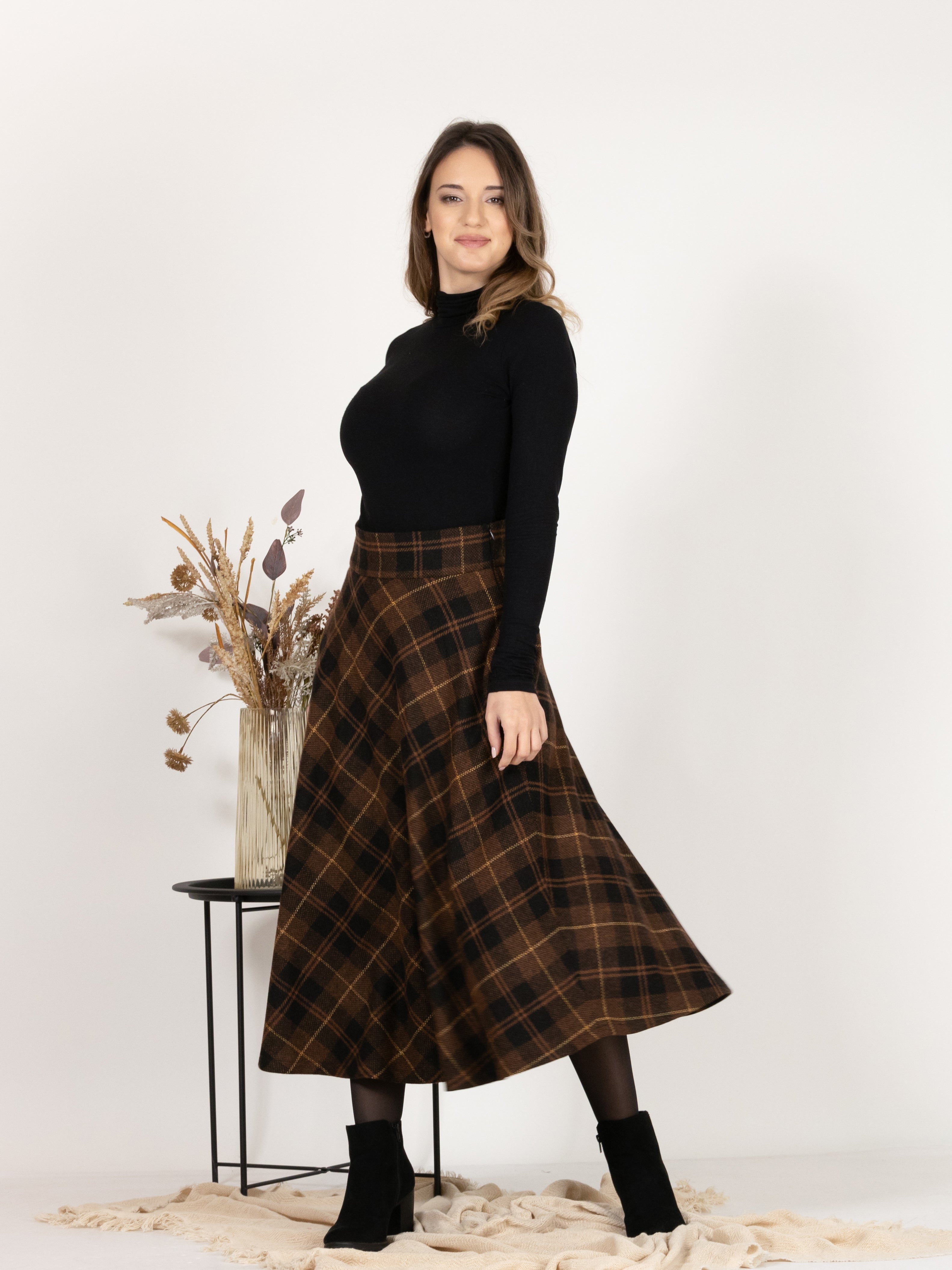 Front view of Midi Wool Plaid Skirt with High Waist and Pockets showcasing the flare and the a-line silhouette
