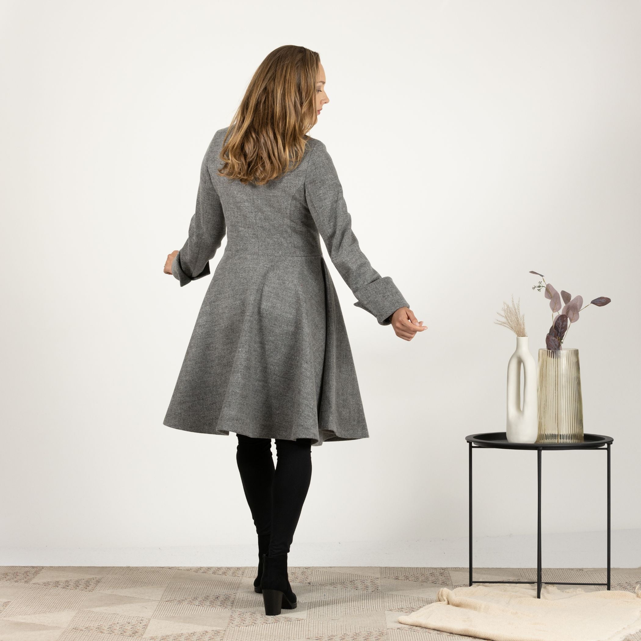 Back view of the Gray A-line Buttoned Winter Coat, emphasizing the classic A-line cut and the full-length design that offers extra warmth.