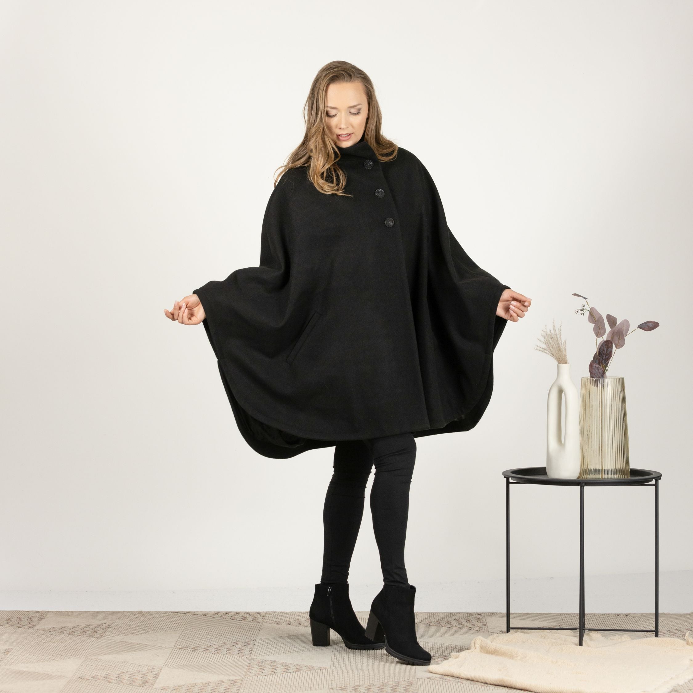 Front view of mid-thigh Wool Poncho Coat paired with jeans