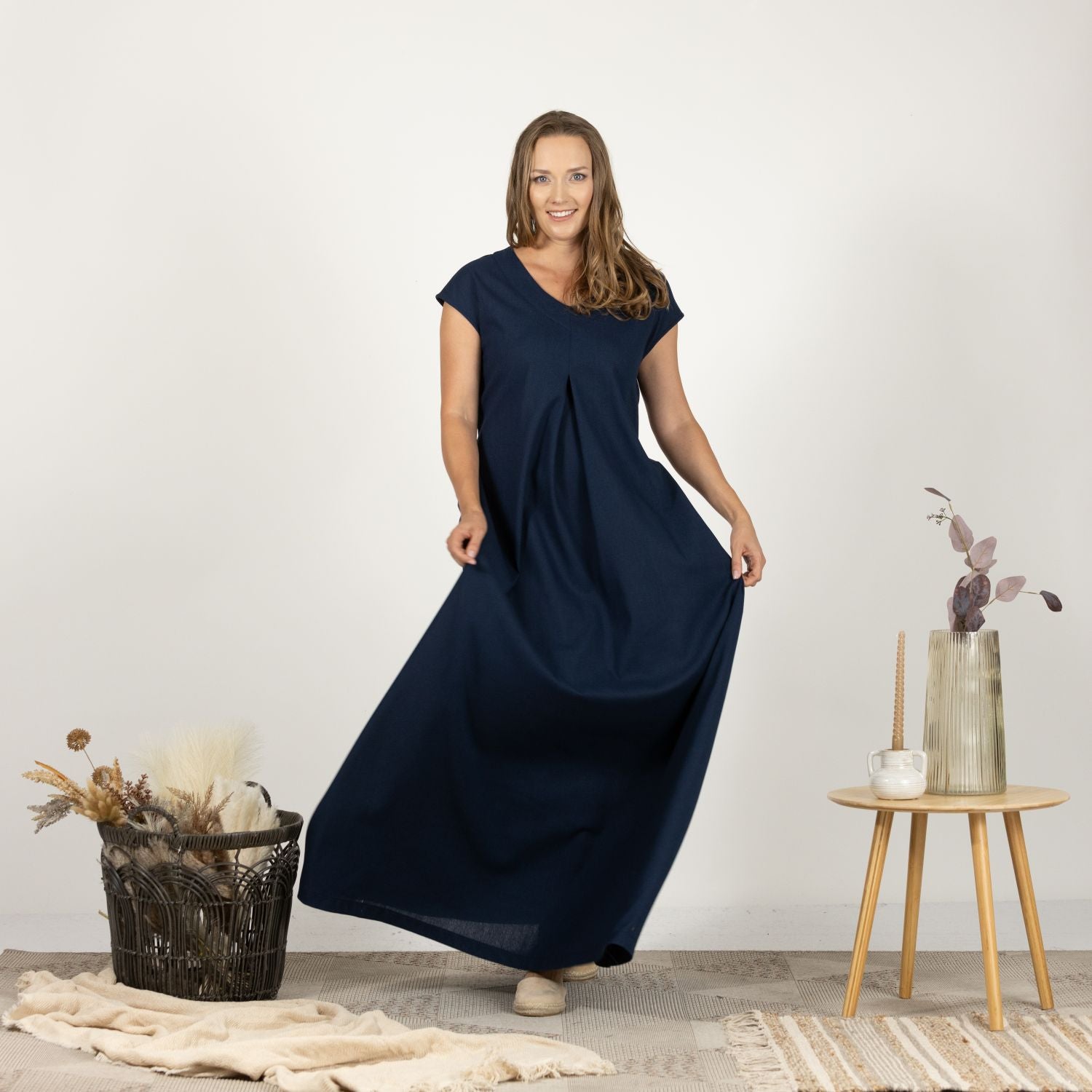 Front perspective of the Linen Loose Dress with Back Tie on model, highlighting the dress's elegant drape and practical design.
