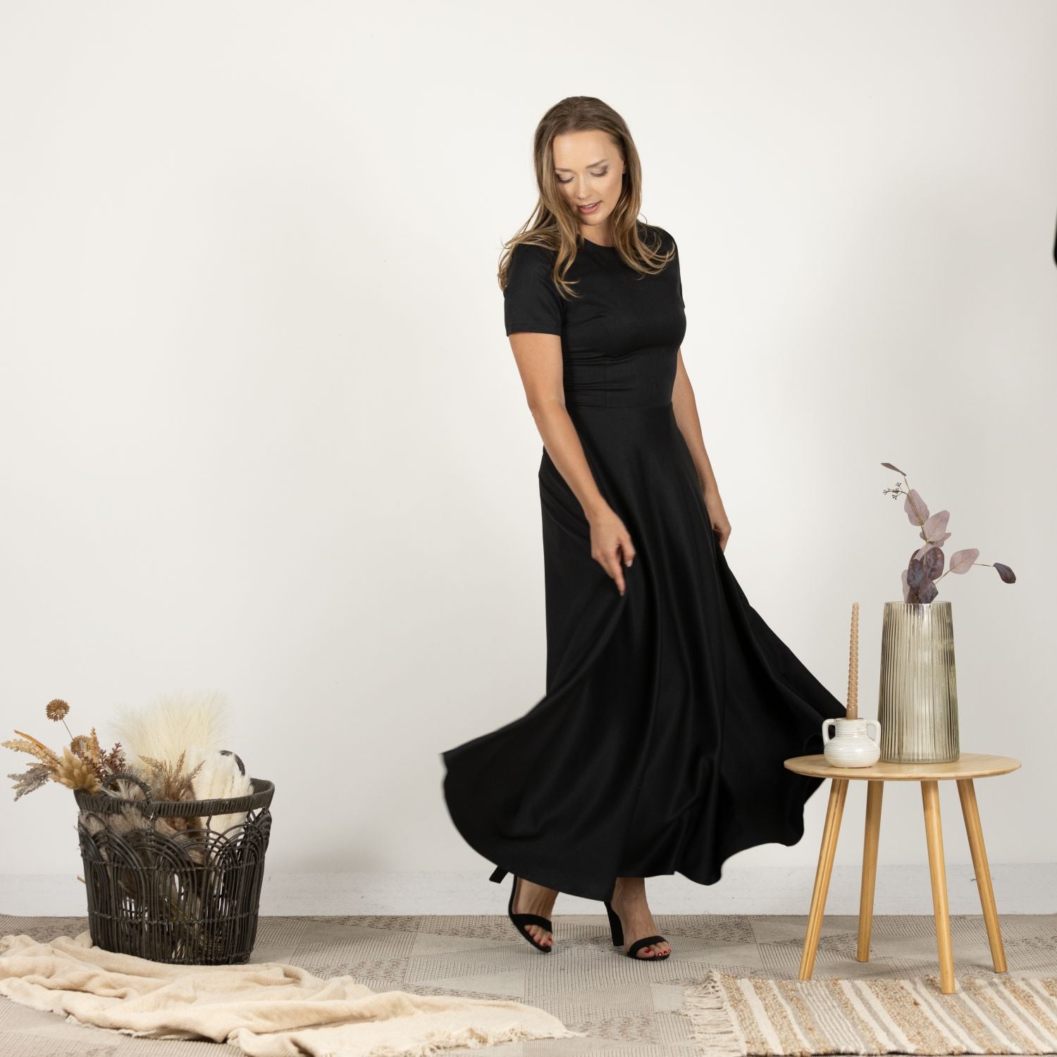 Side view of the model wearing the Short Sleeve Modest Summer Dress, illustrating its full-length design and modest short sleeves