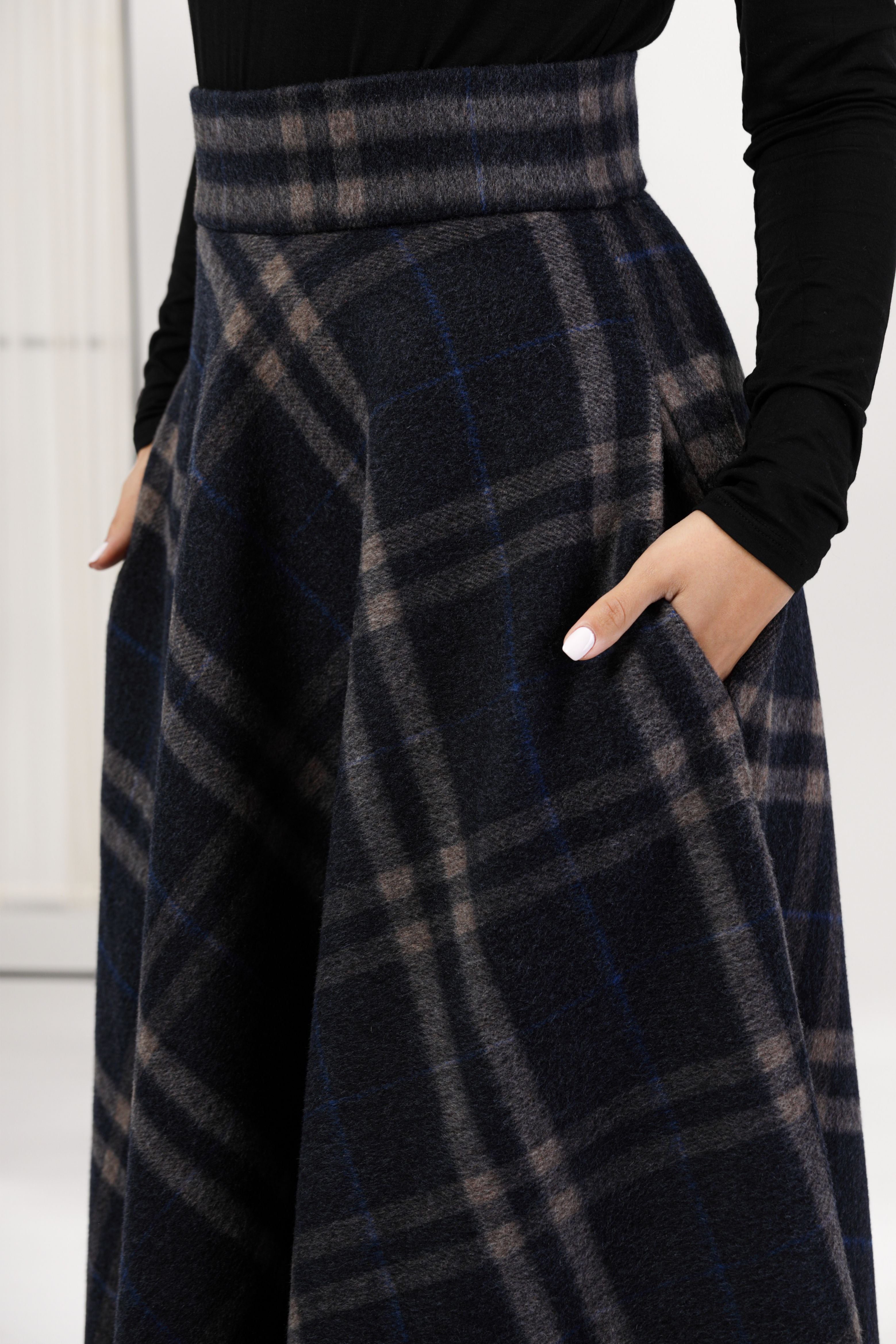 Close-up front view of the Plaid High Waisted Wool Maxi Skirt, focusing on the intricate plaid pattern and the soft, warm wool fabric.