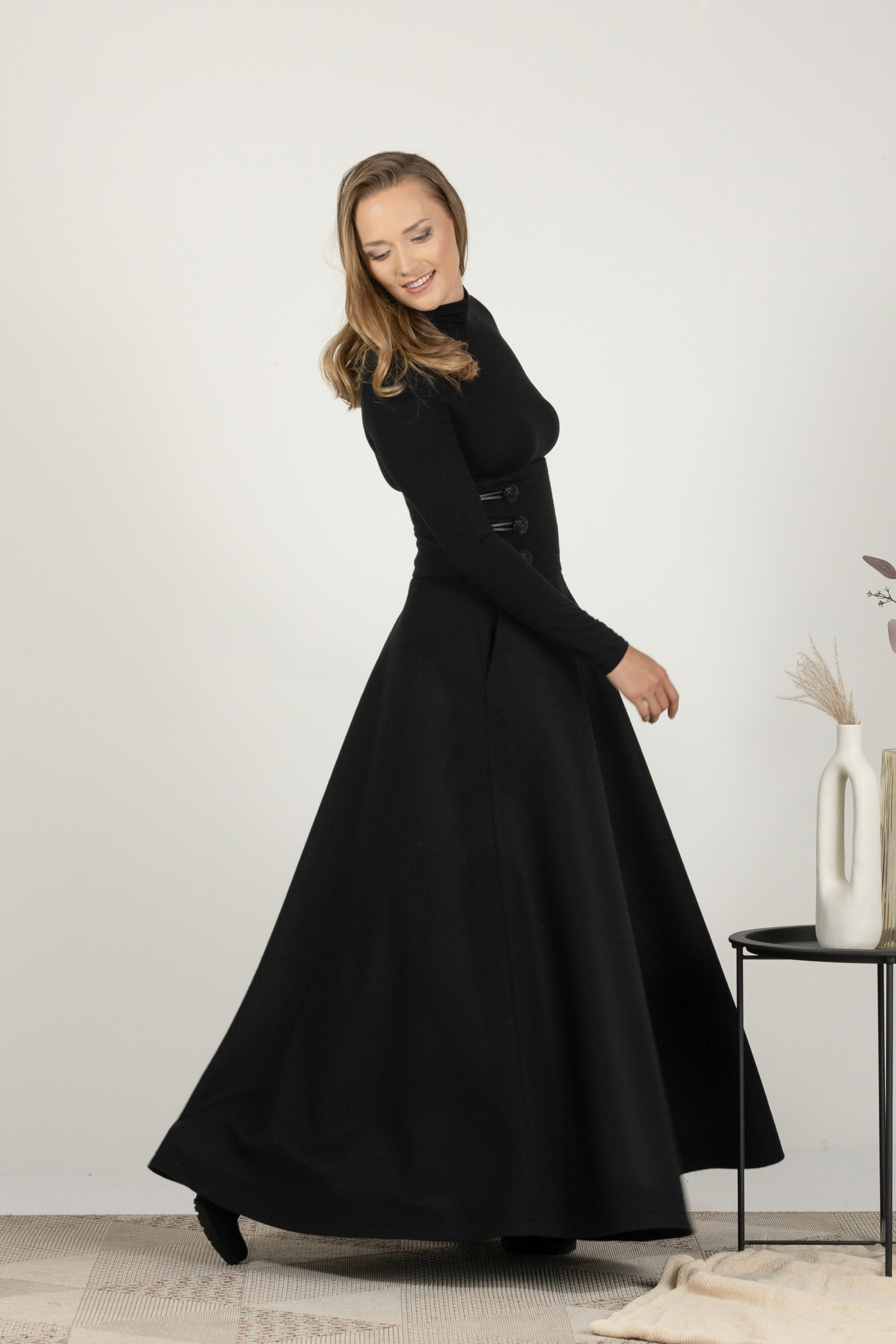 High-waisted black wool maxi with timeless design