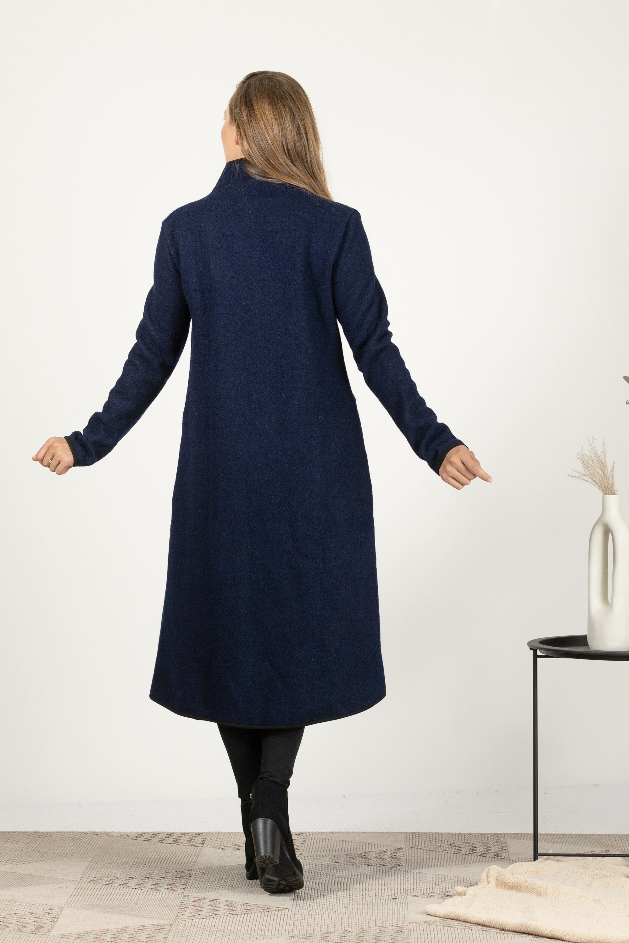 Back view of Dark blue boiled wool coat with high collar