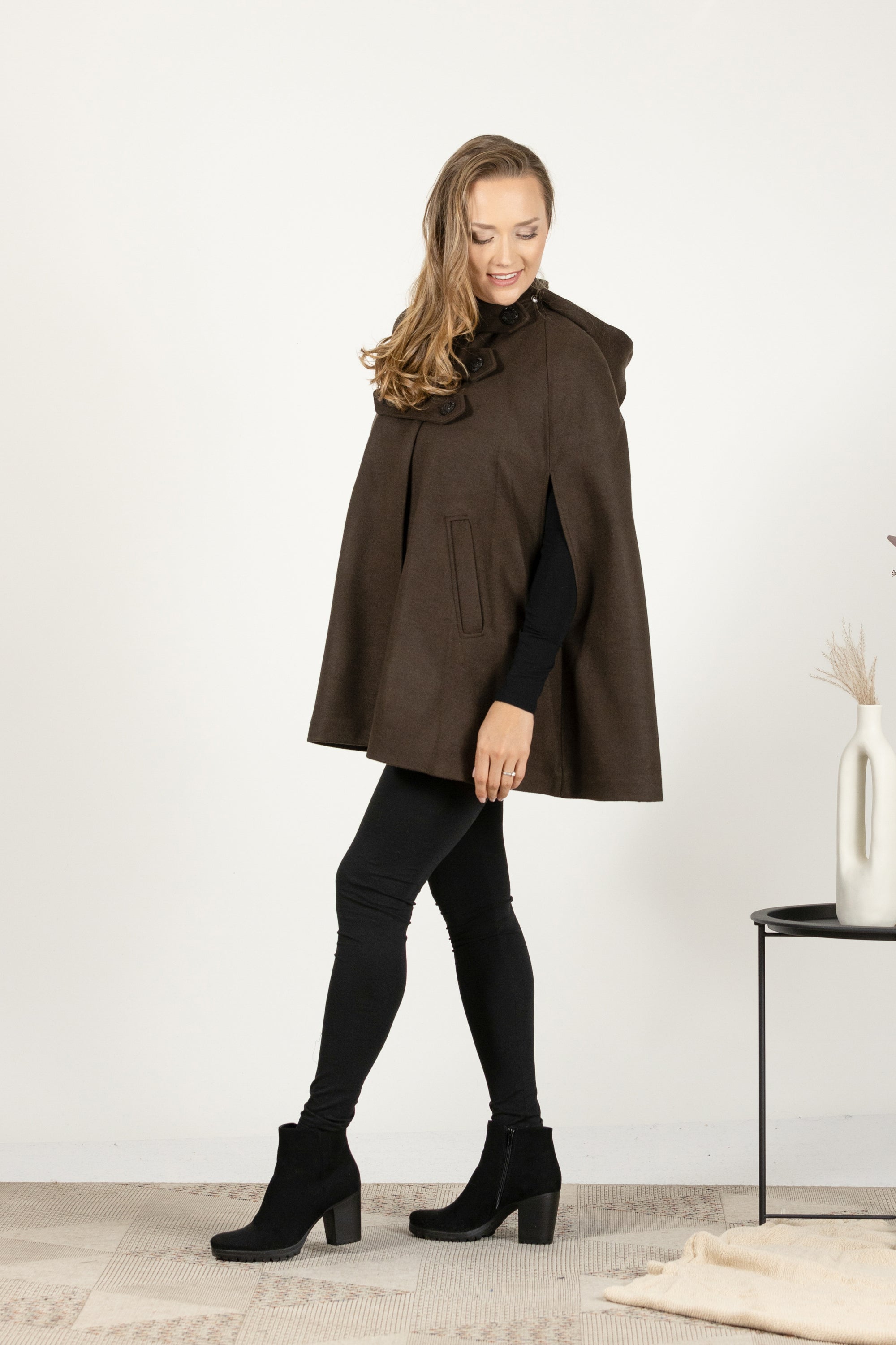 Side view of Brown wool cape coat with hood and buttons