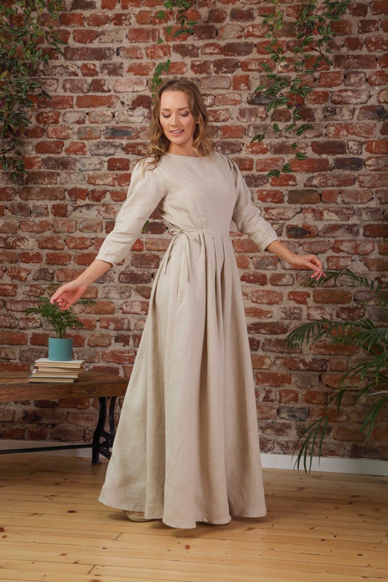 Summer capsule wardrobe, woman in a natural long-sleeve linen maxi dress
