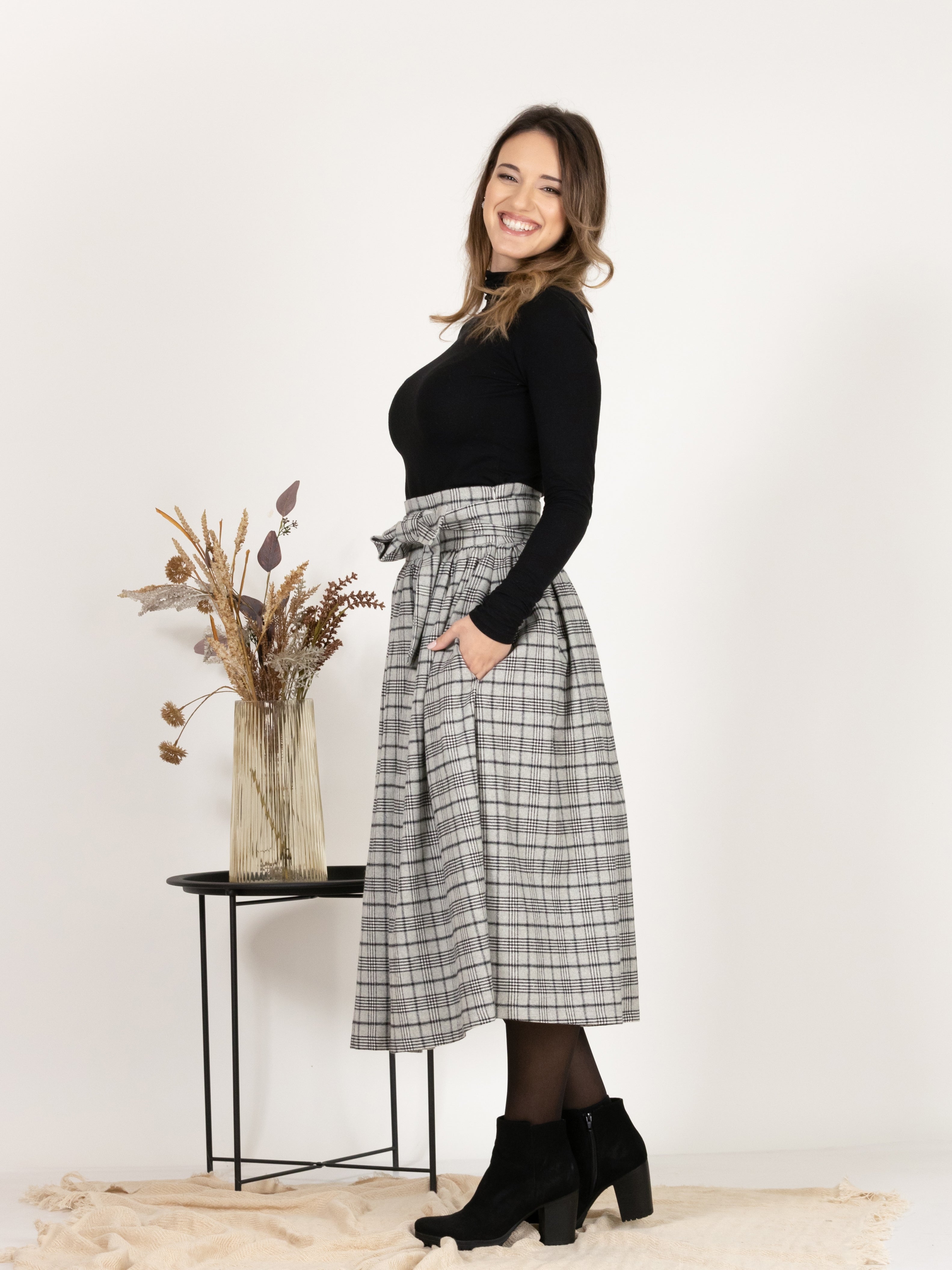 Side view of Wool Midi Plaid Skirt with High Waisted Bow and Pockets
emphasizing the side pockets