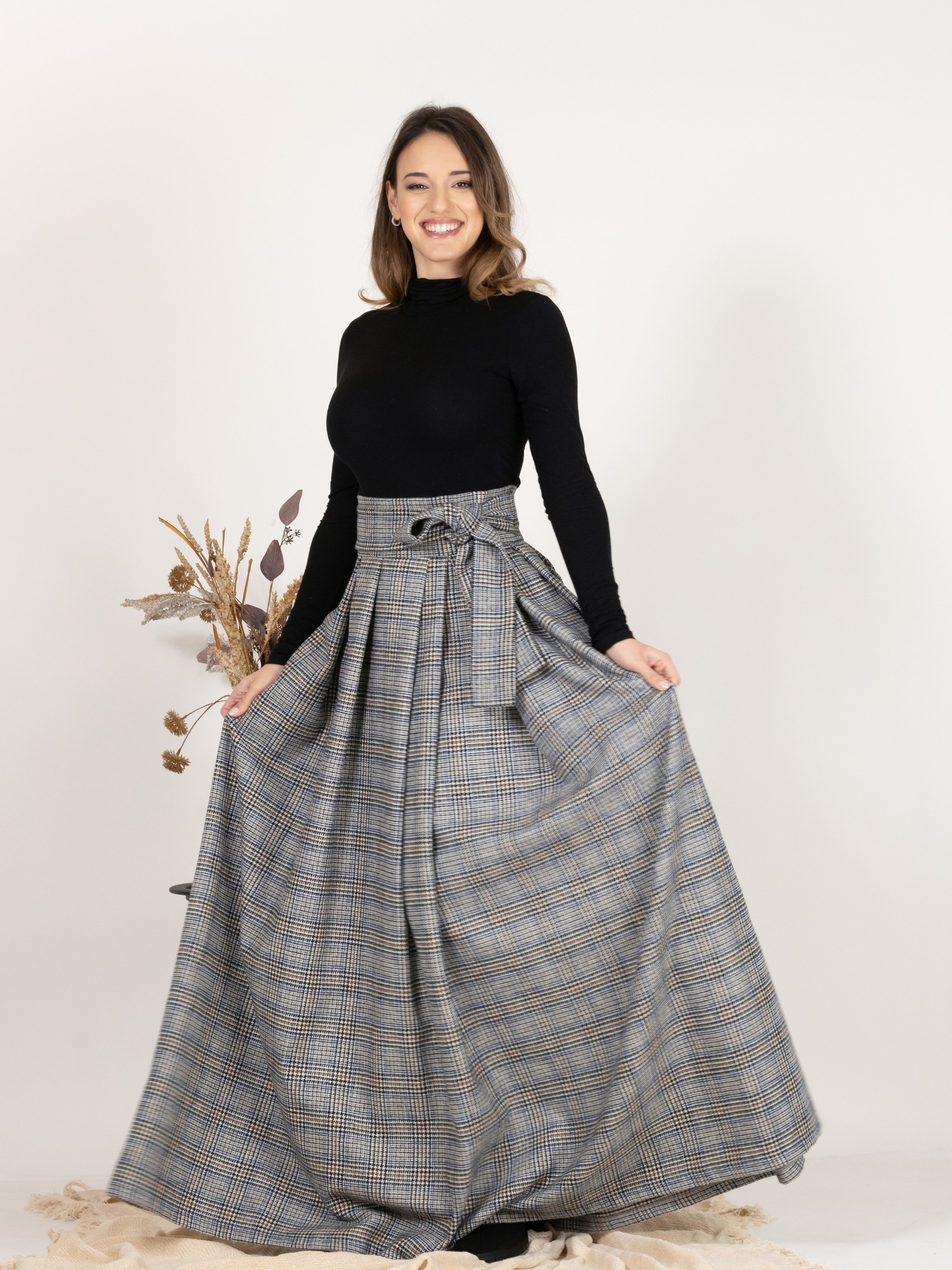 Front view showing the bow detail of Plaid Wool Pleated Skirt with Ultra High Waist and Bow