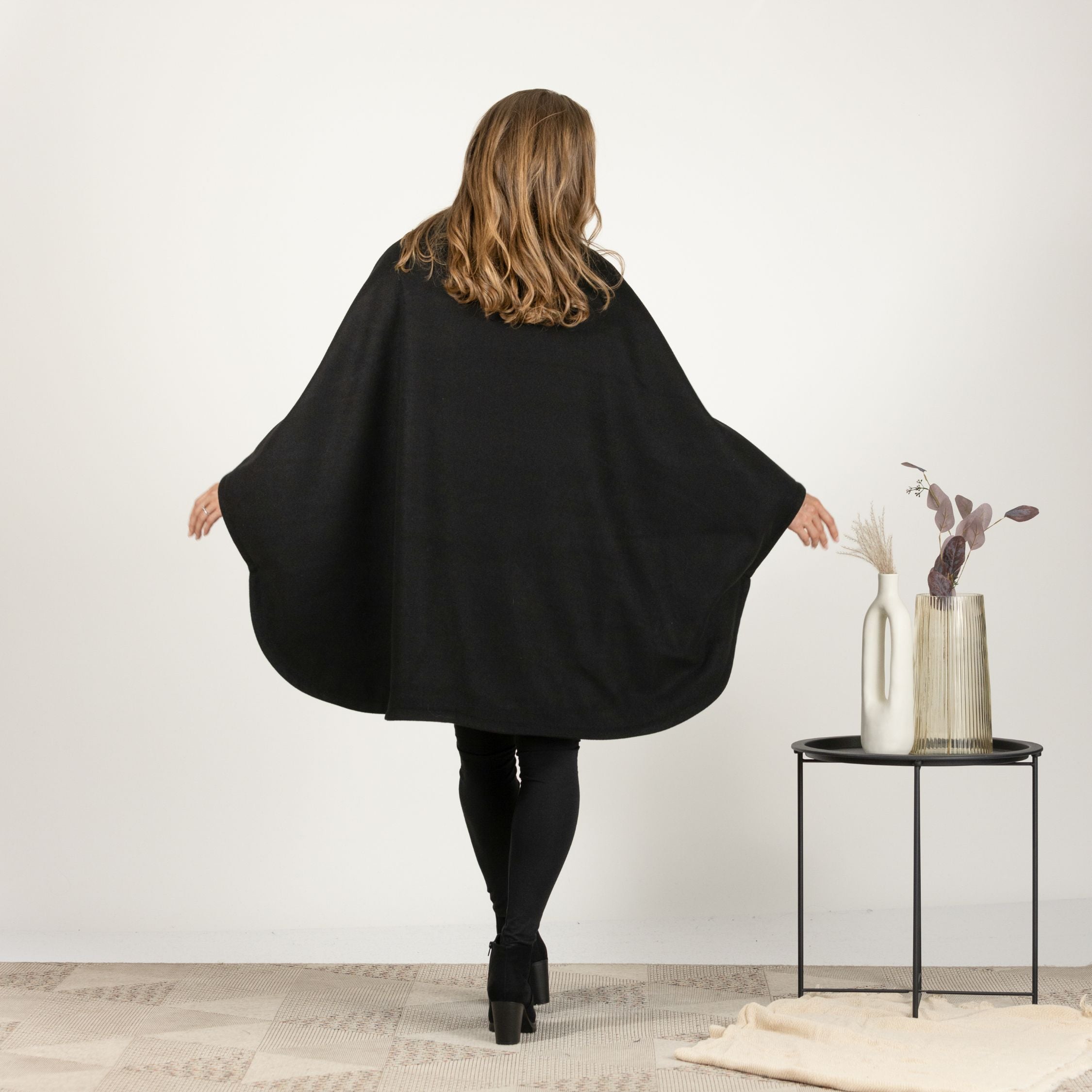 Back view of Oversized Wool Poncho Coat highlighting relaxed fit