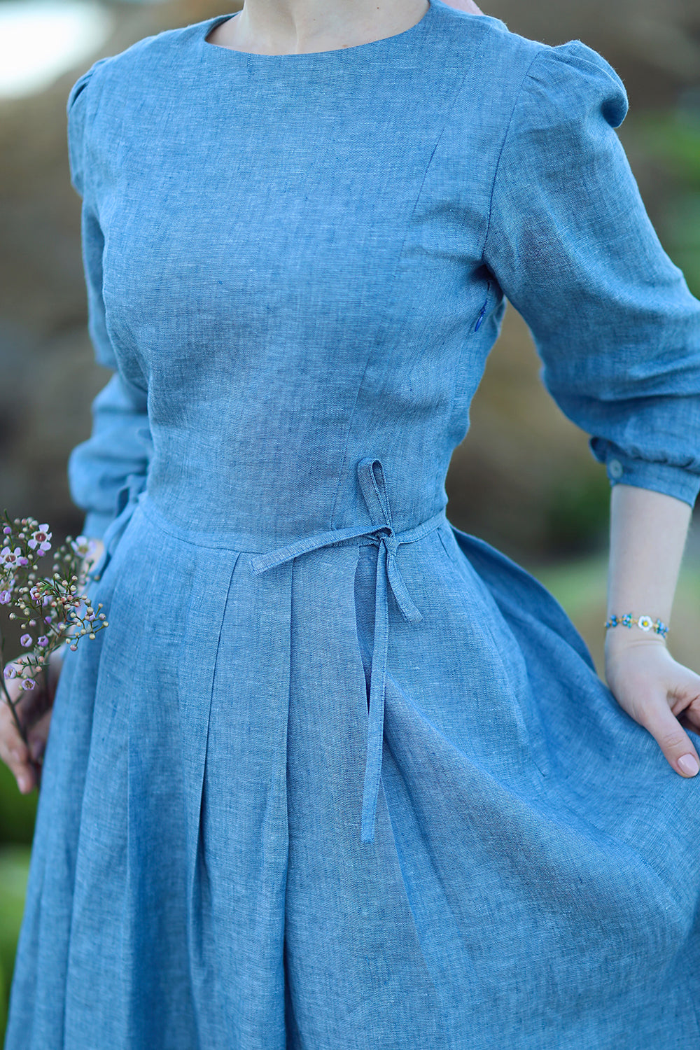 Close up of Natural blue linen maxi dress with long sleeves

