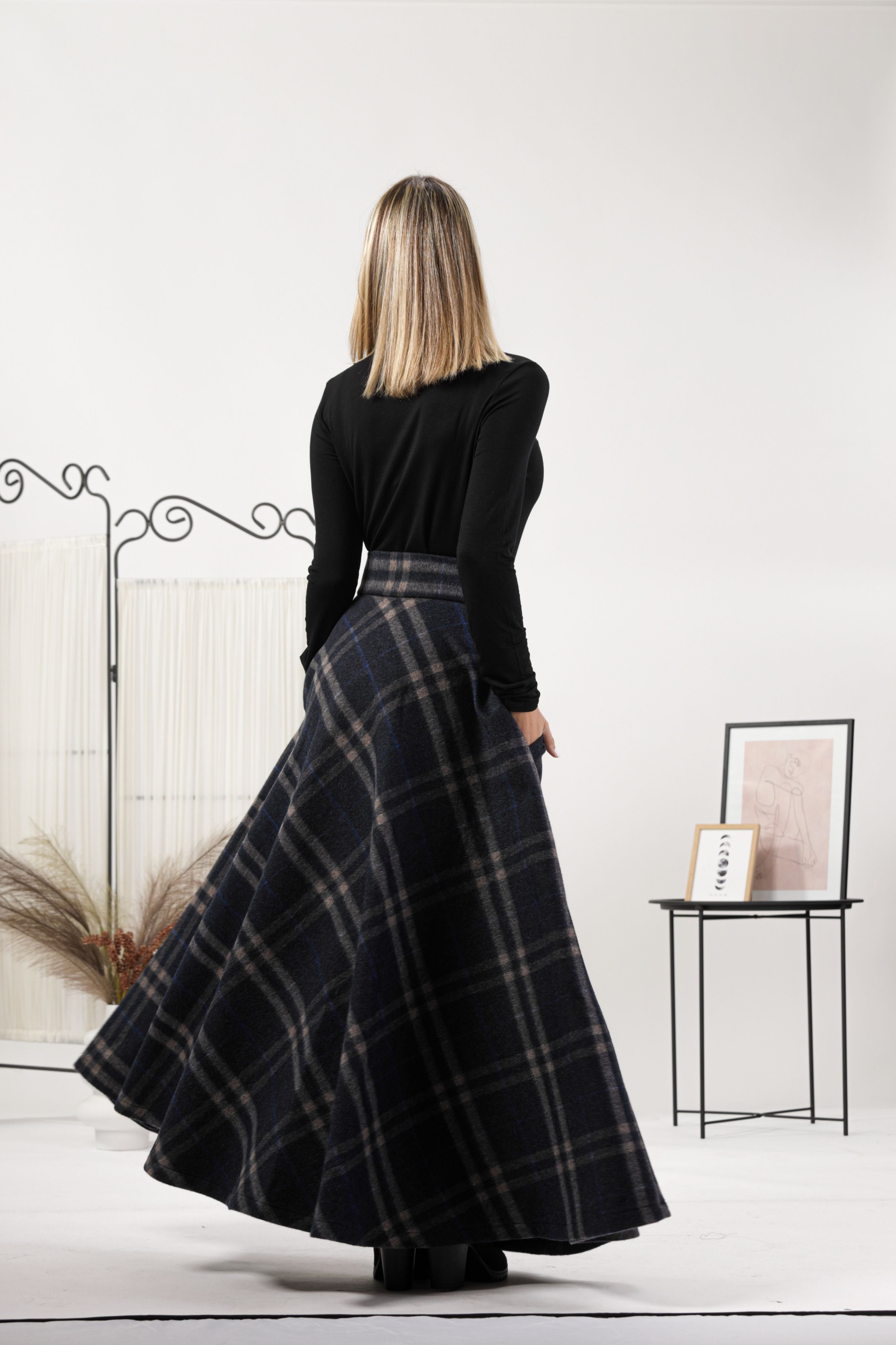 Back view of the Plaid High Waisted Wool Maxi Skirt, emphasizing the clean lines and the full A-line, flared silhouette for a classic look.