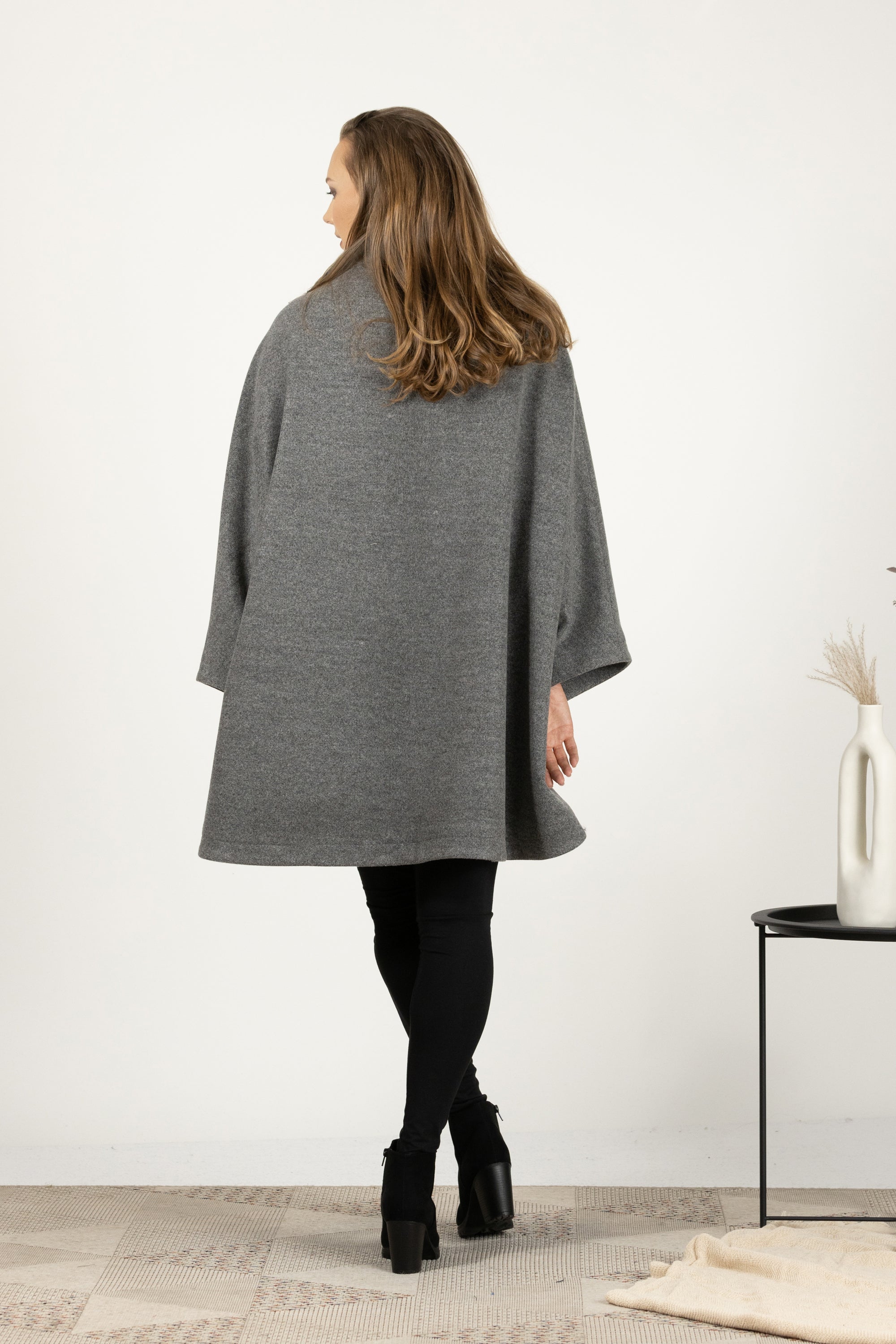Back side of One-size gray cape coat with buttons and pockets