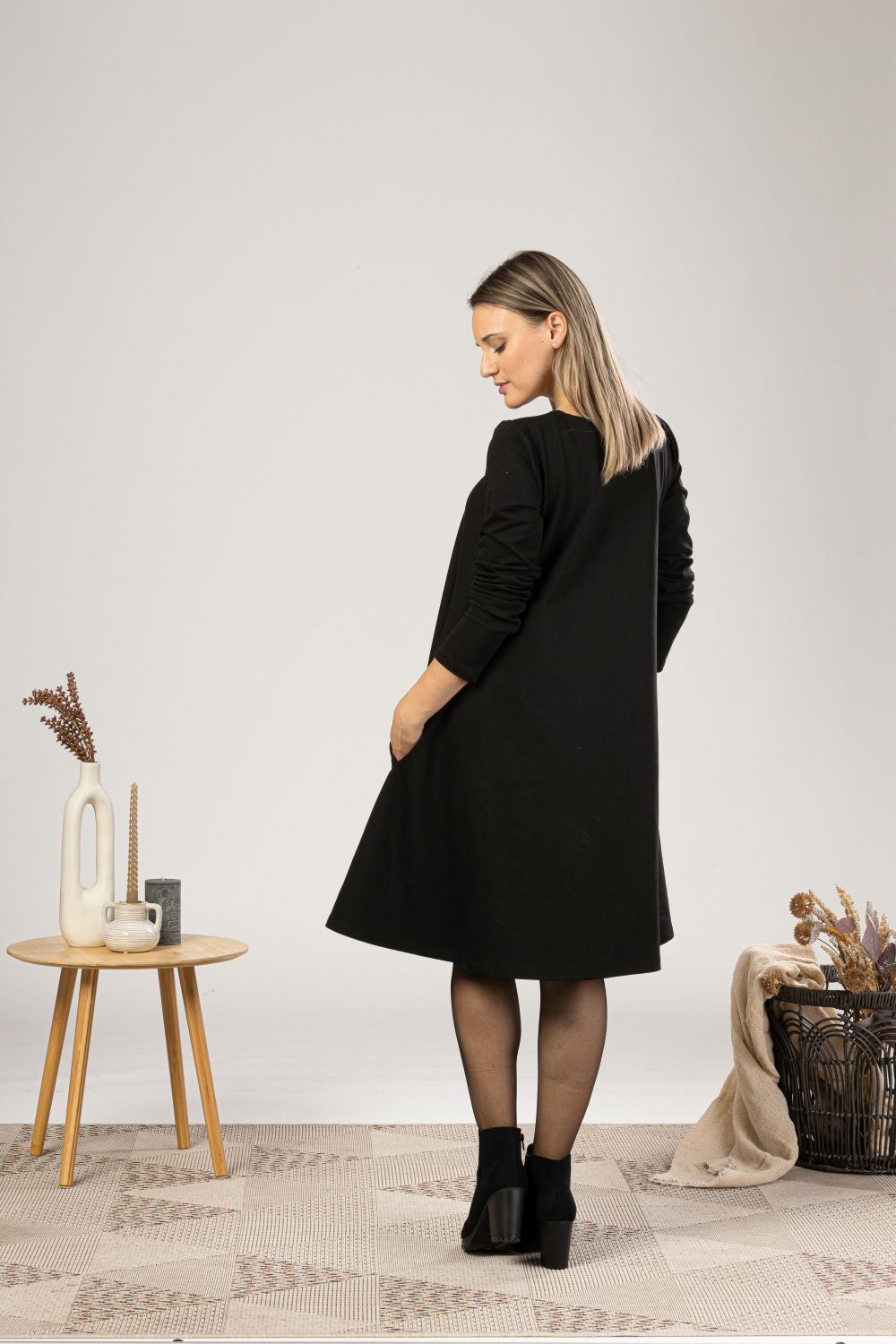Back view of Minimalist wool dress with pockets
