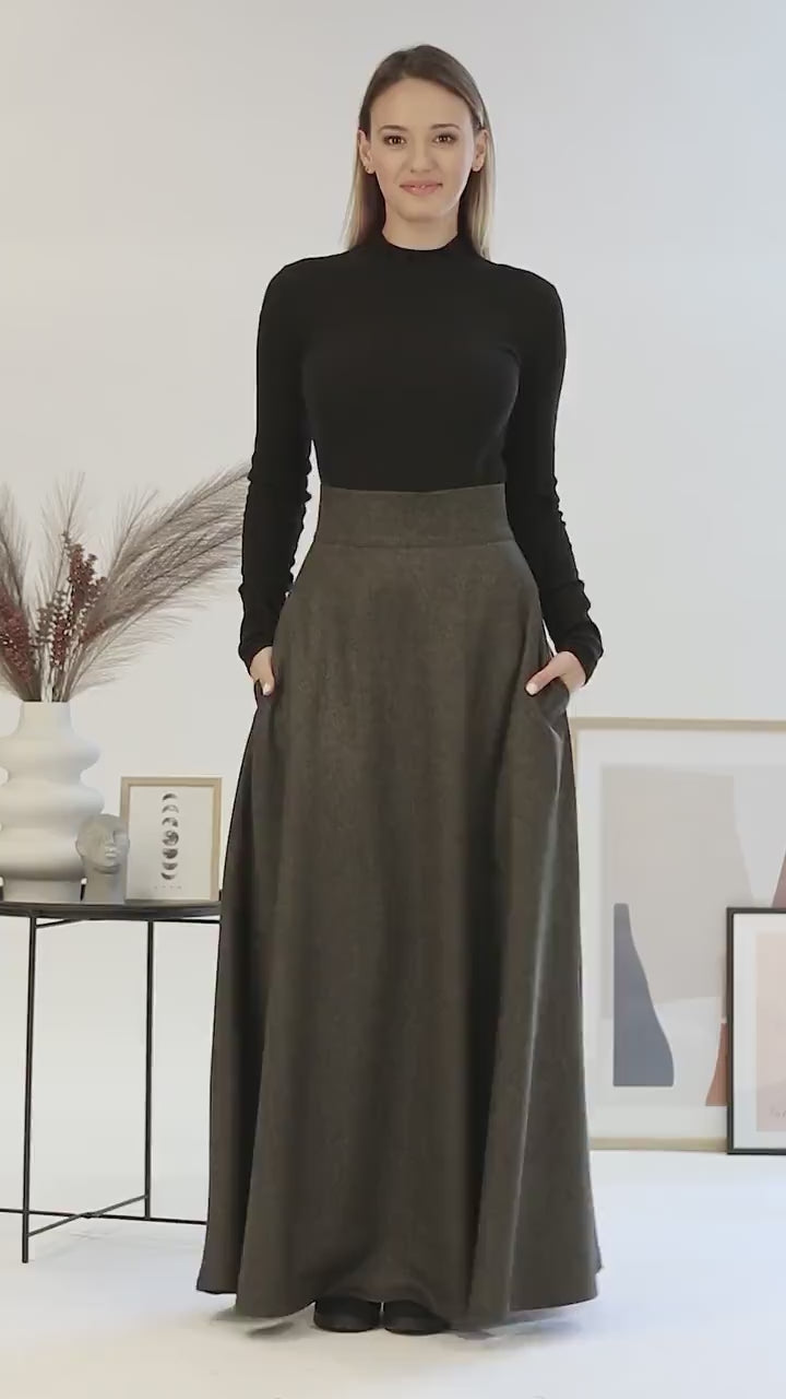 Skirt displayed flat on a neutral background, showing the clean cut, pattern, and stitching details.

