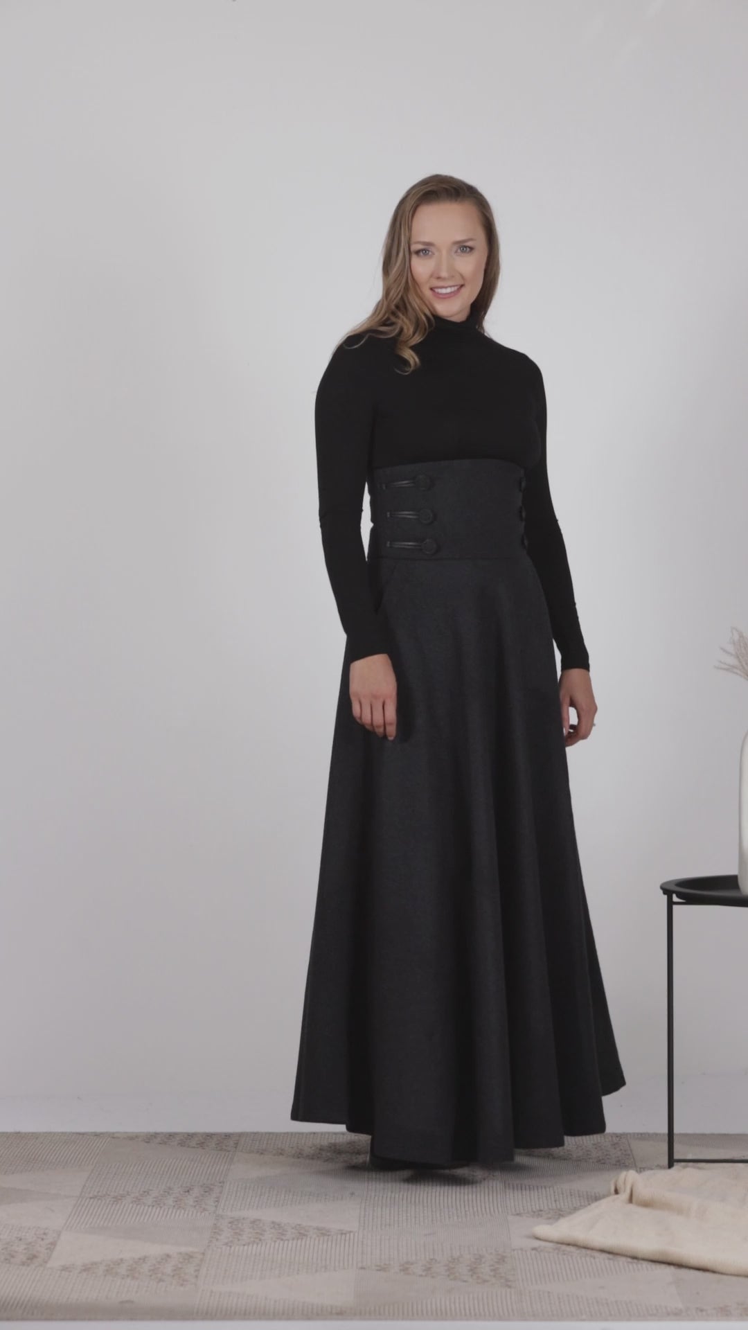 Full view of flared winter skirt in black wool with pockets