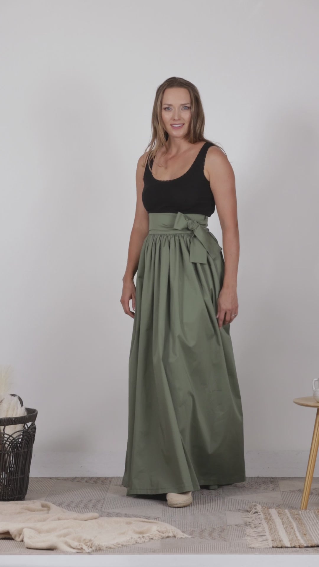 Full view of Elegant dark green cotton skirt with a relaxed silhouette